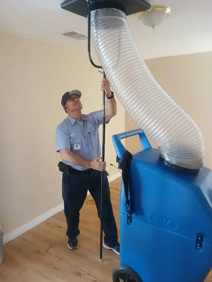 Furnace Tune-Up technician using HEPA equipment in Hyattsville